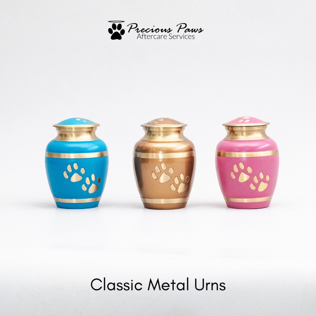 Classic metal urns in blue, bronze, and pink with gold paw accents