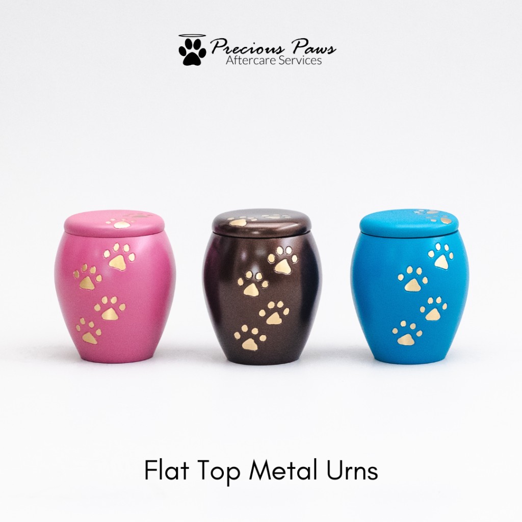Flat top metal urns in pink, brown, and blue with gold paw accents